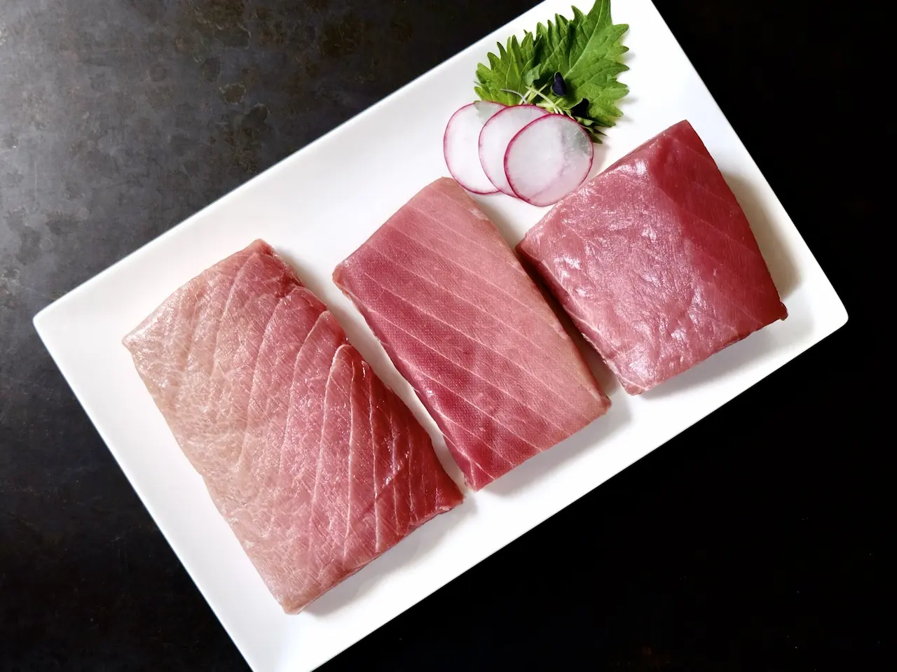 All three cuts of Nagasaki Bluefin Tuna side by side — Otoro, Chutoro, and Akami